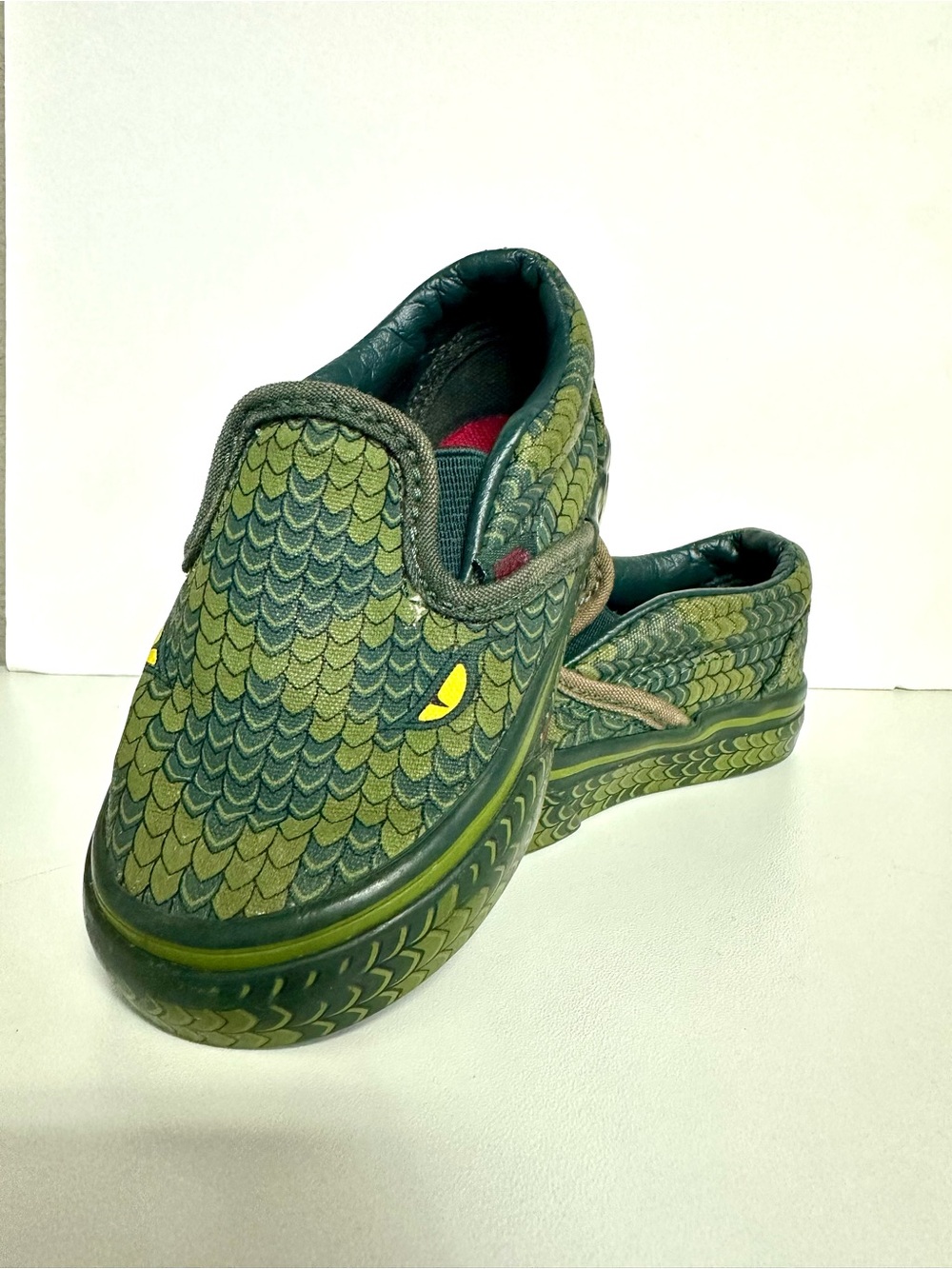 Vans Kids Green Dragon-Scale Slip-On Sneakers with Yellow Eye Accent